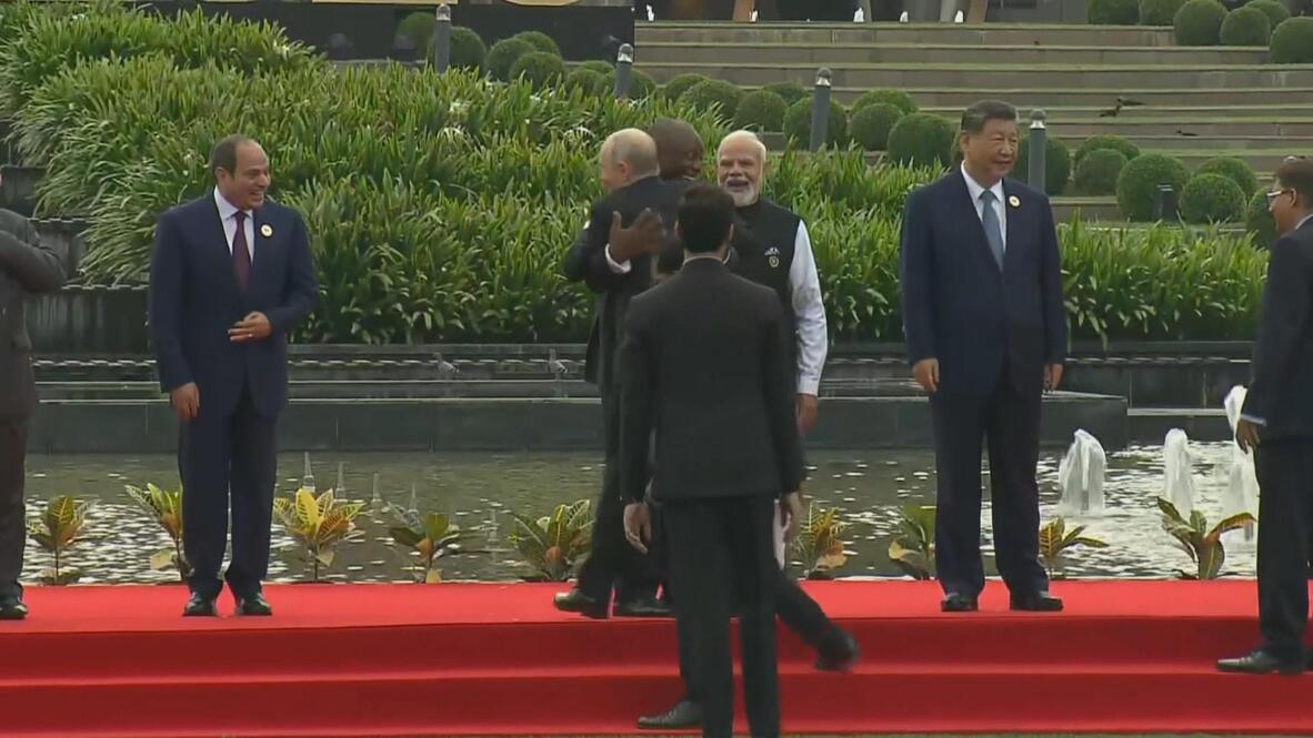 Trading places - Putin and Ramaphosa share warm hug as leaders swap spots for BRICS group photo